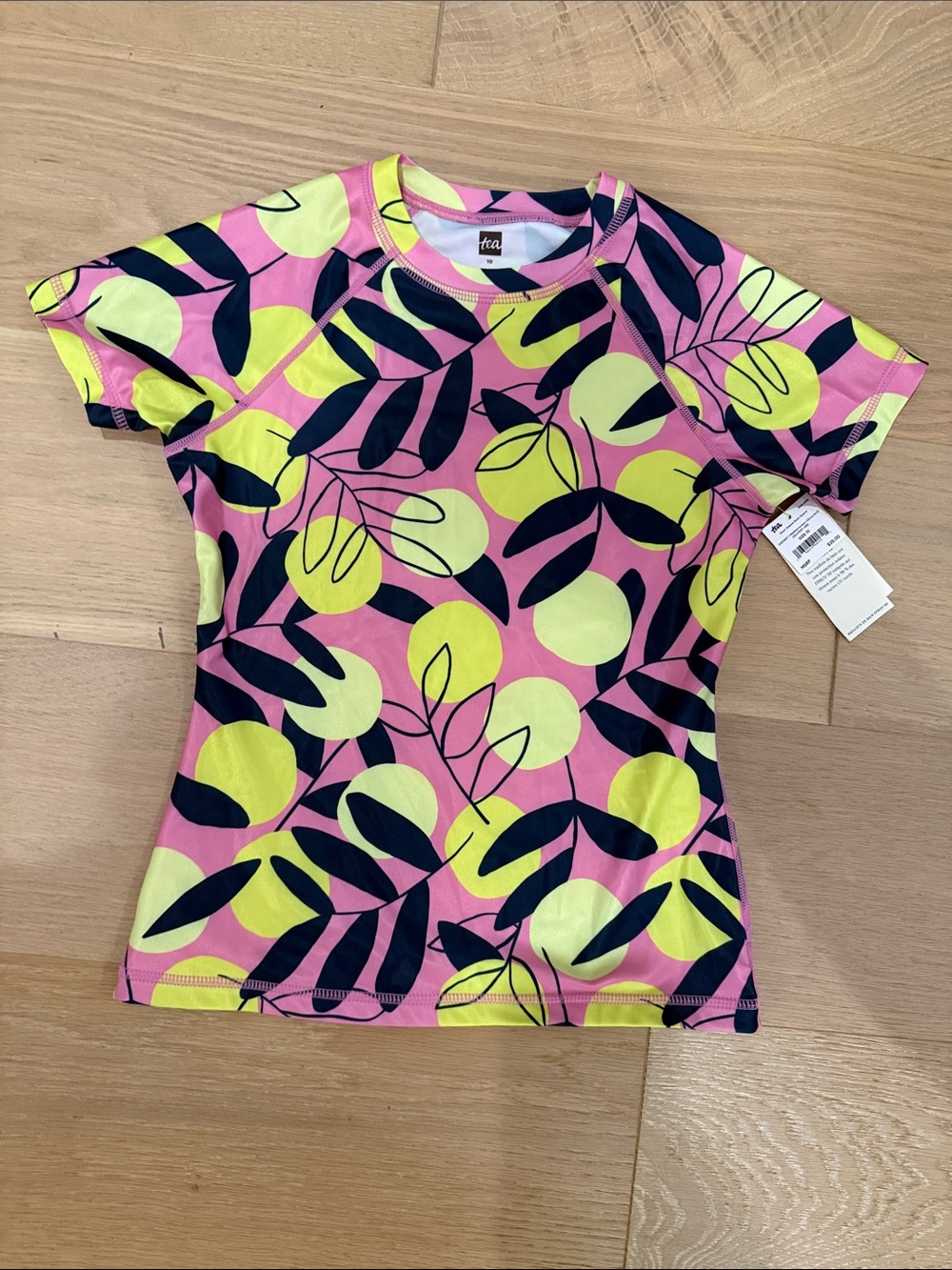 NWT Tea Collection Kids Pink Neon Yellow Navy Short Sleeve Rashguard size 10